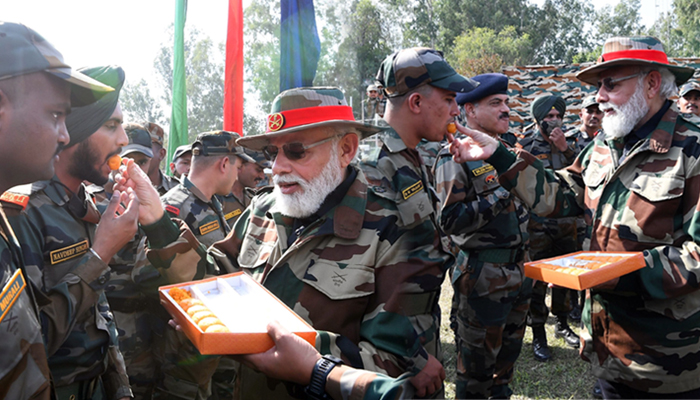 primeminister offering sweet to brave soilders